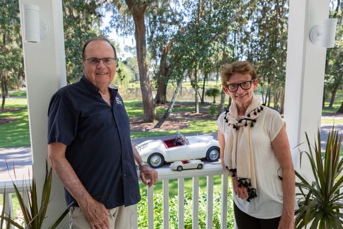 Ken and Melon Doris with a toy version of the MGA, and the real thing behind